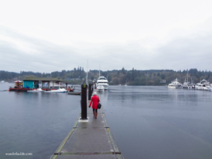Walking along a quiet pier on a gray day in Bainbridge Island near Seattle. 
