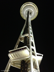 Looking up at the Space Needle at night.