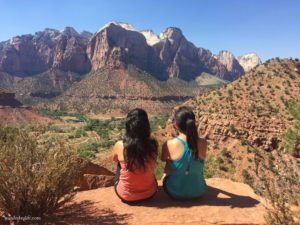 Sitting side by side with my sister overlooking the view from the top of the Watchman Trail.