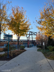 Get some sun: The Chicago 606 walking trail with a few distant runners during the daytime in fall.