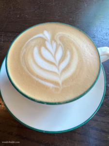 Getting coffee while jet-lagged: Pretty latte art on my cup of coffee from a local coffee shop.