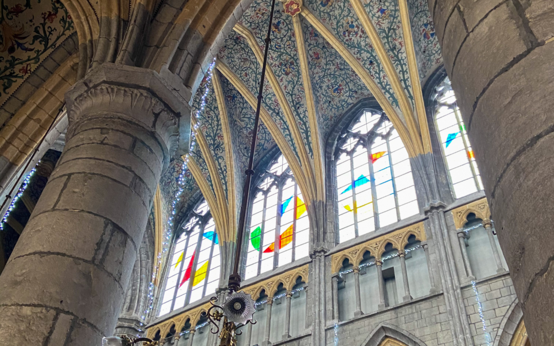 The stained glass windows and Gothic arches in Cathédrale Saint-Paul de Liège in Belgium.