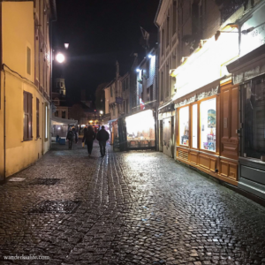 A quiet cobbled street in an evening in Honfleur, France.