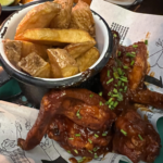 Wings and fries from Bogotá Beer Company. 