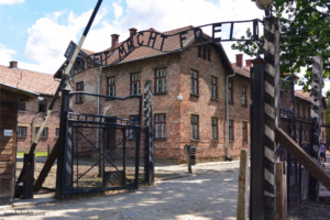 The infamous front gate of Auschwitz inscribed with "Work sets you free" during a humble summer visit.